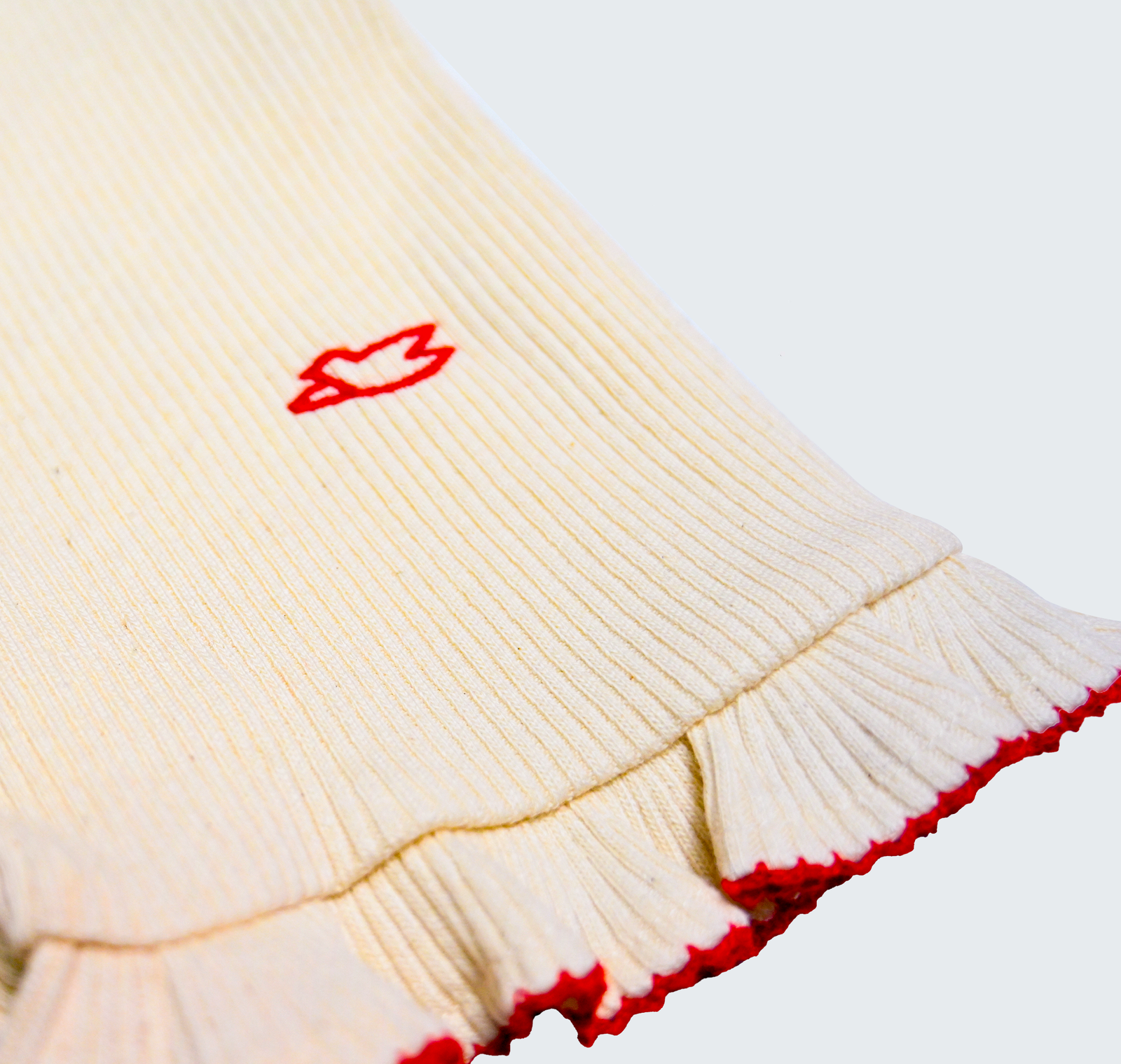 Barboteuse à bretelles avec col rond